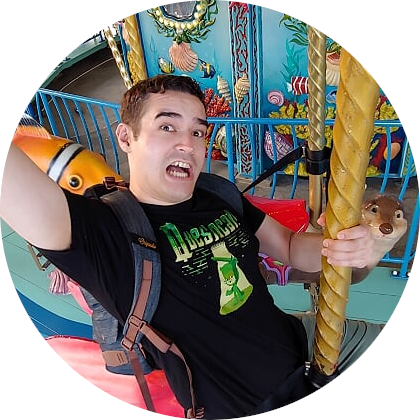 Mike Wallio making a
  silly face on a carousel